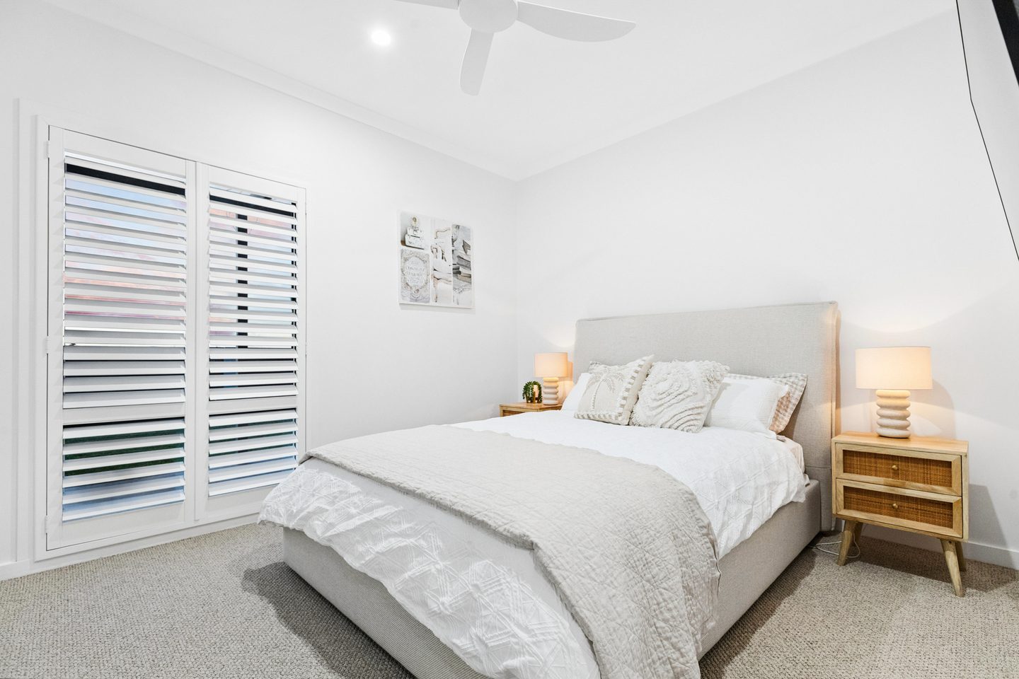 A secondary bedroom with shutters