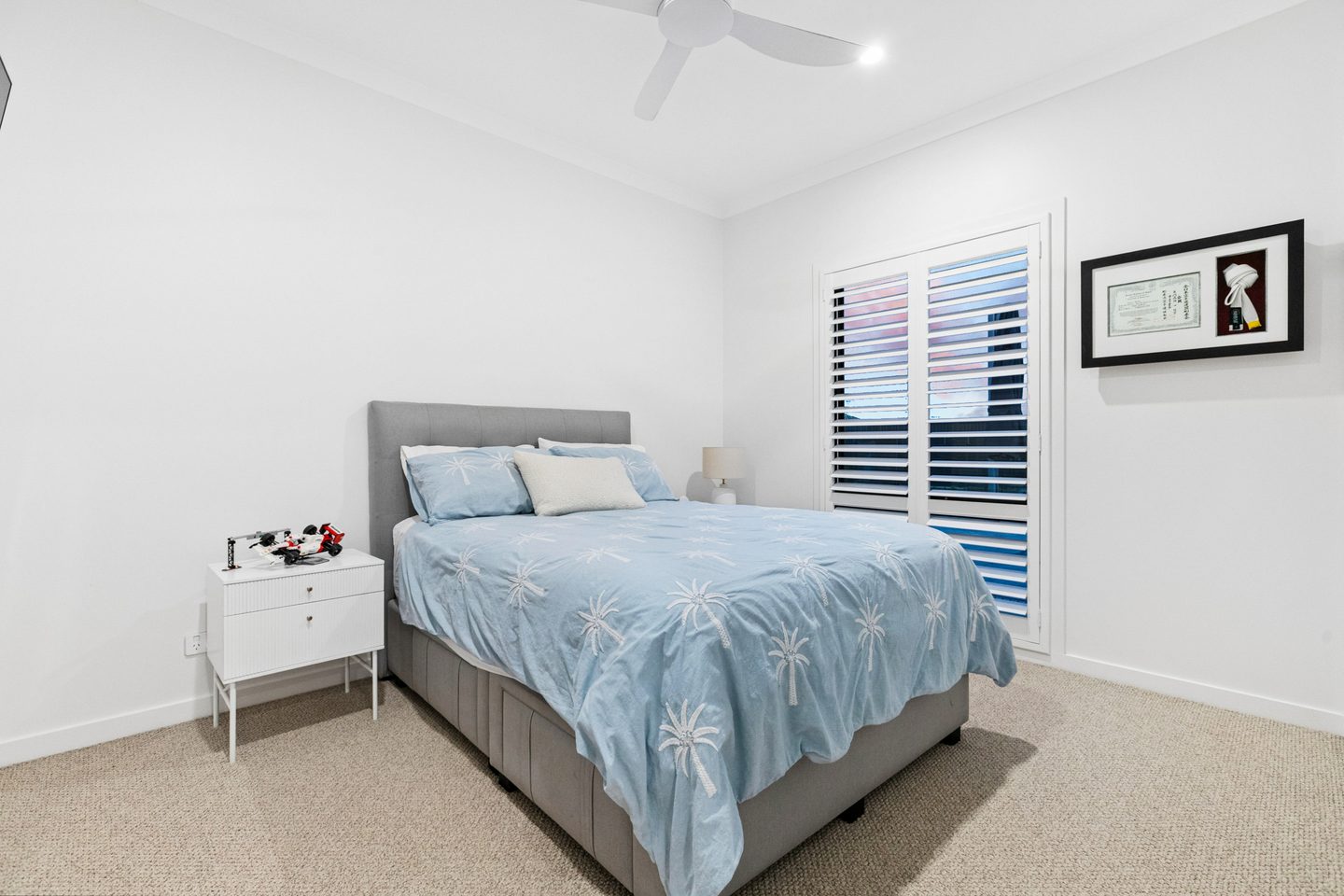 A secondary bedroom with corner windows
