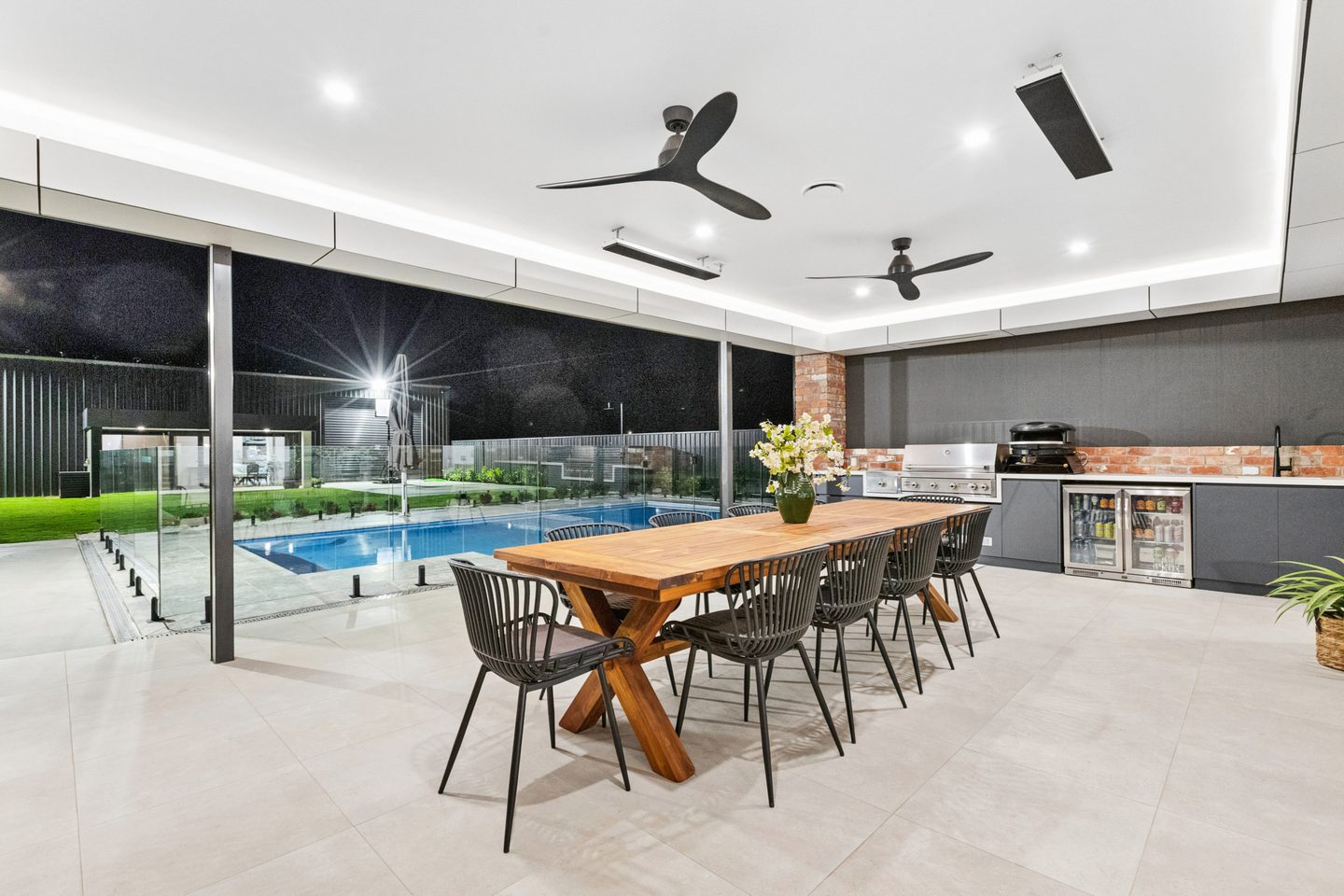 Undercover alfresco with outdoor kitchen and outlook to the pool