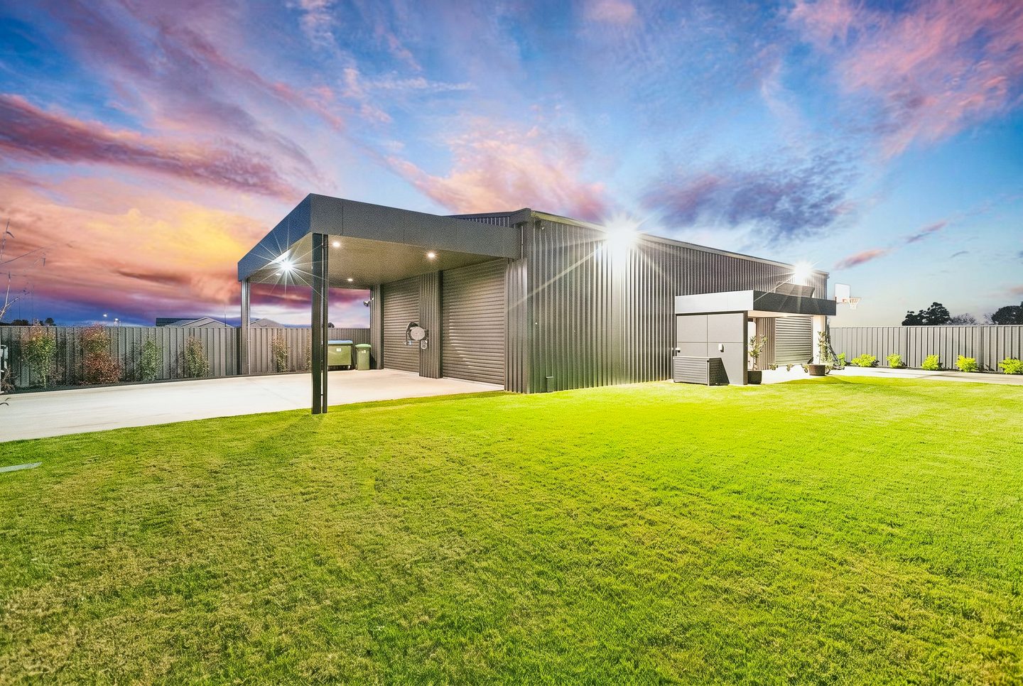 The shed, covered area and lawn